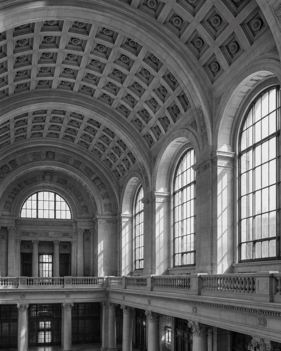 Vaulted coffered ceiling and upper gallery of a historic exchange hall